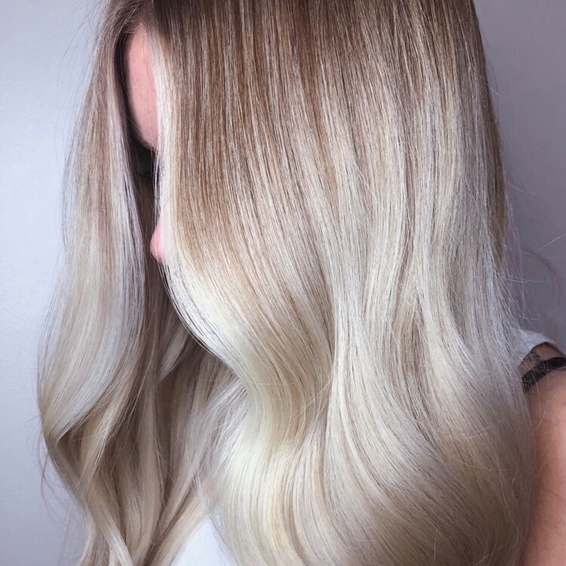 Woman blonde hair after using Olaplex No. 6 Bond Smoother.